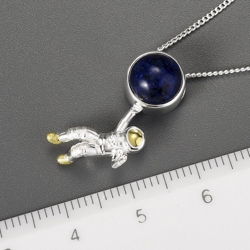 Charm pendant astronaut with stones and cold enamel silver blackened