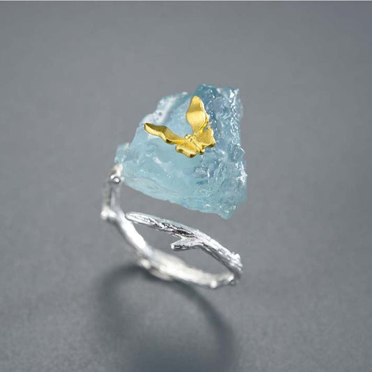 Deja Veux Jewelry Aqua Butterfly Adjustable Ring  Metals Type: 925 Sterling Silver / 18K Gold plated Main stone: Aquamarine Item Weight: About 6.77g Size: Adjustable